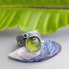 Green tourmaline and blue topaz ring in textured sterling silver