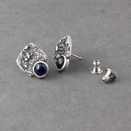 Showing clutches for blue sapphire stud earrings in textured sterling silver