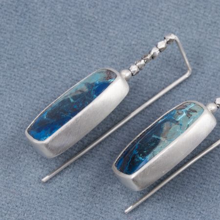 Closeup of Azurite earrings in brushed sterling silver with embellished ear wires