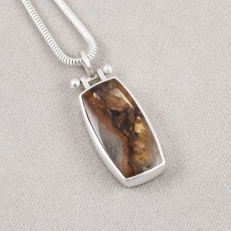 Included quartz pendant in brushed sterling silver