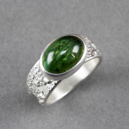Green tourmaline ring with textured bright brushed silver band