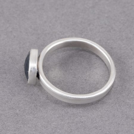 Side view of teal blue tourmaline ring in brushed sterling silver