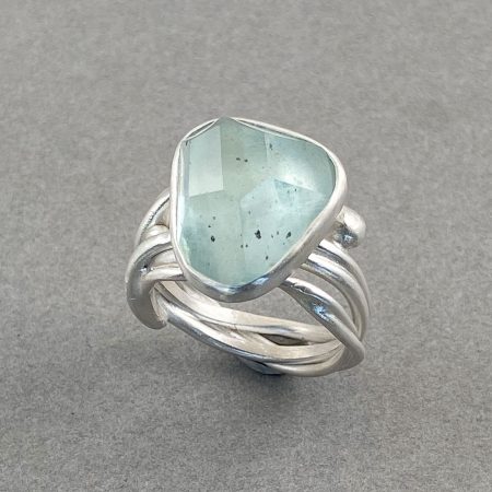 Aquamarine on tangled ring in brushed sterling silver, UK size O