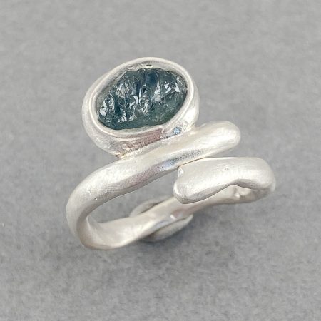 Raw blue sapphire on molten ring in brushed sterling silver, UK size O